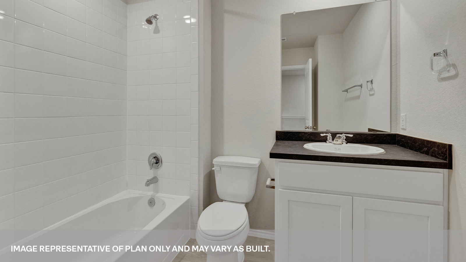 Bathroom 2 with shower and tub, toilet and a single sink vanity.