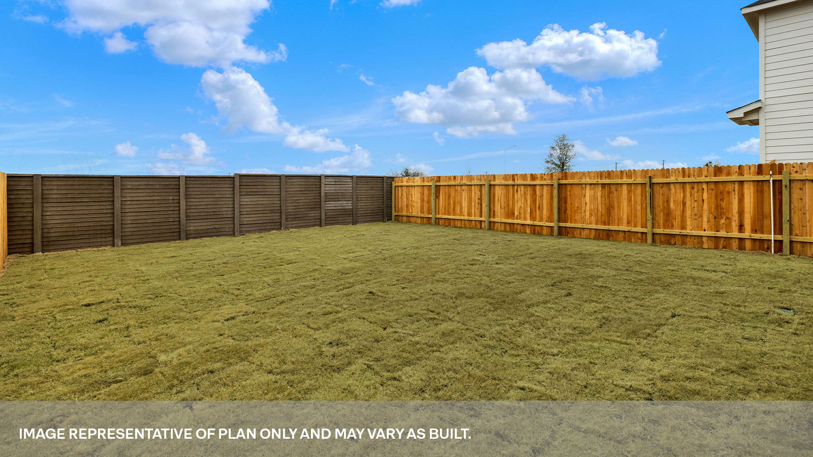 Fully sodded back yard and privacy fence.