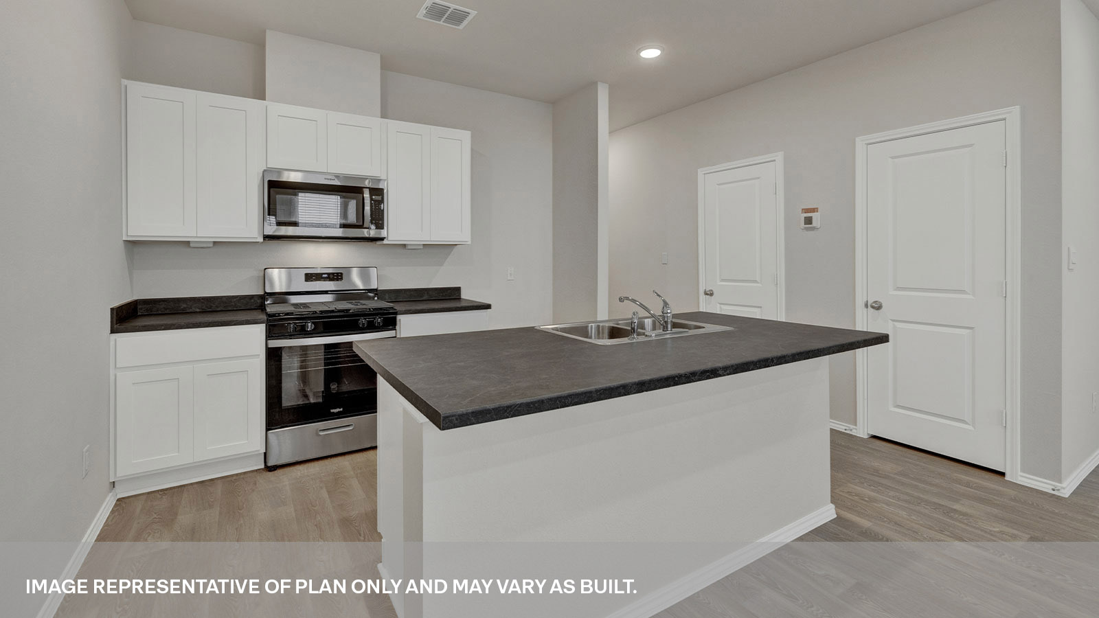Kitchen island, countertops and pantry door.