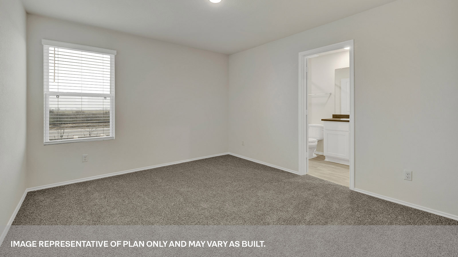 Main bedroom with carpeting with one window and entry to the bathroom.