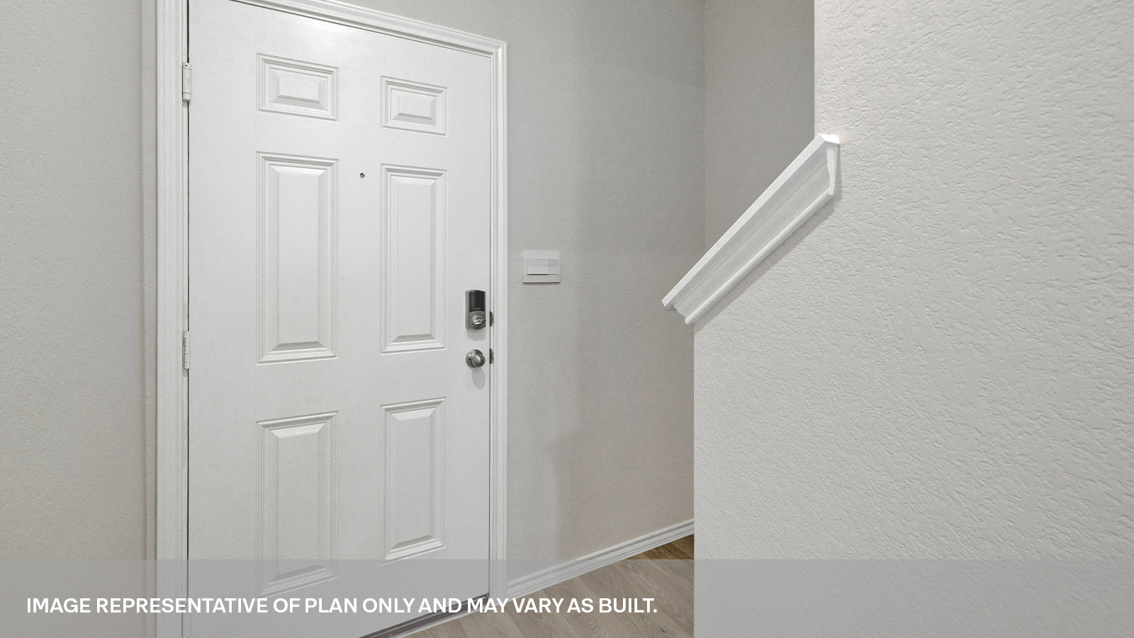 Entry hallway with vinyl fooring and front door.