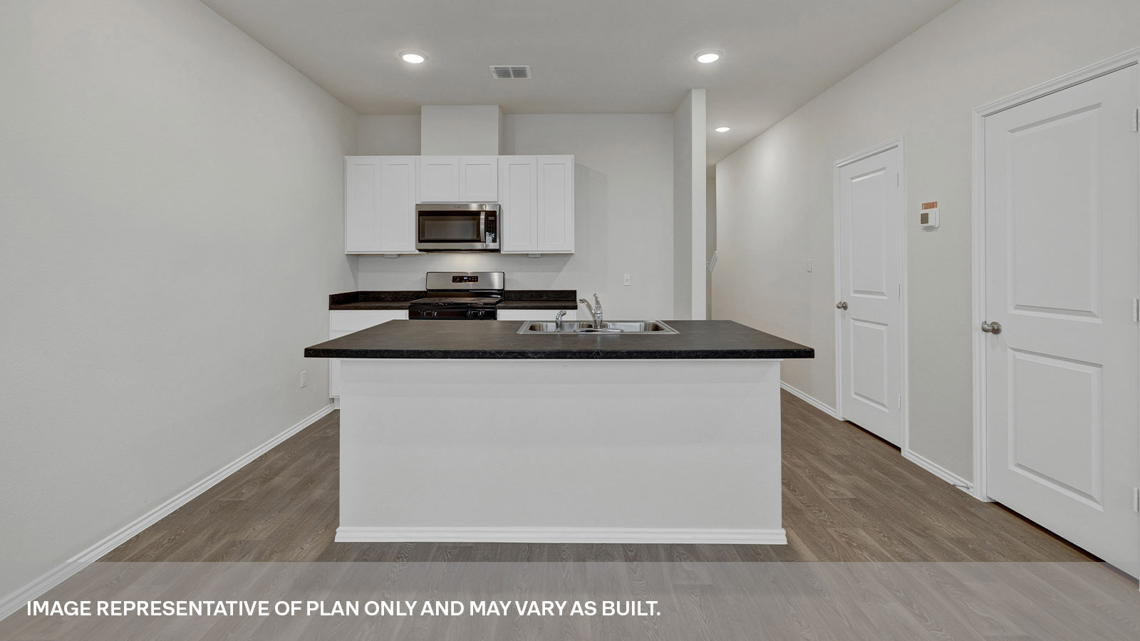 Kitchen island, countertops and pantry door.