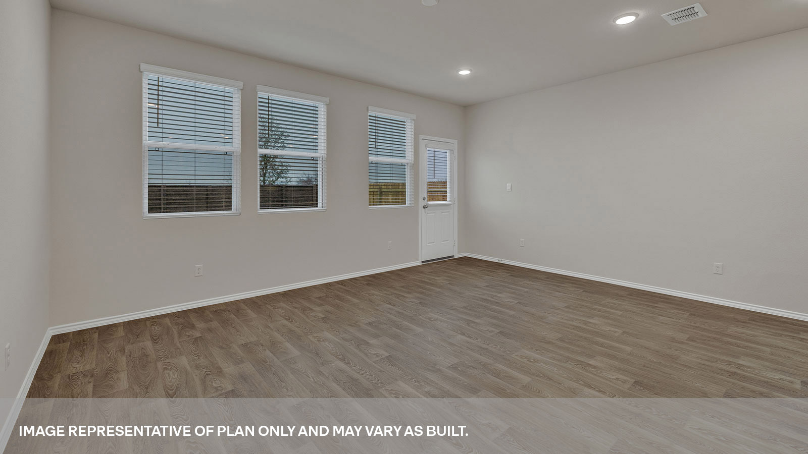 Living area with 3 windows and backdoor with a half-lite window.