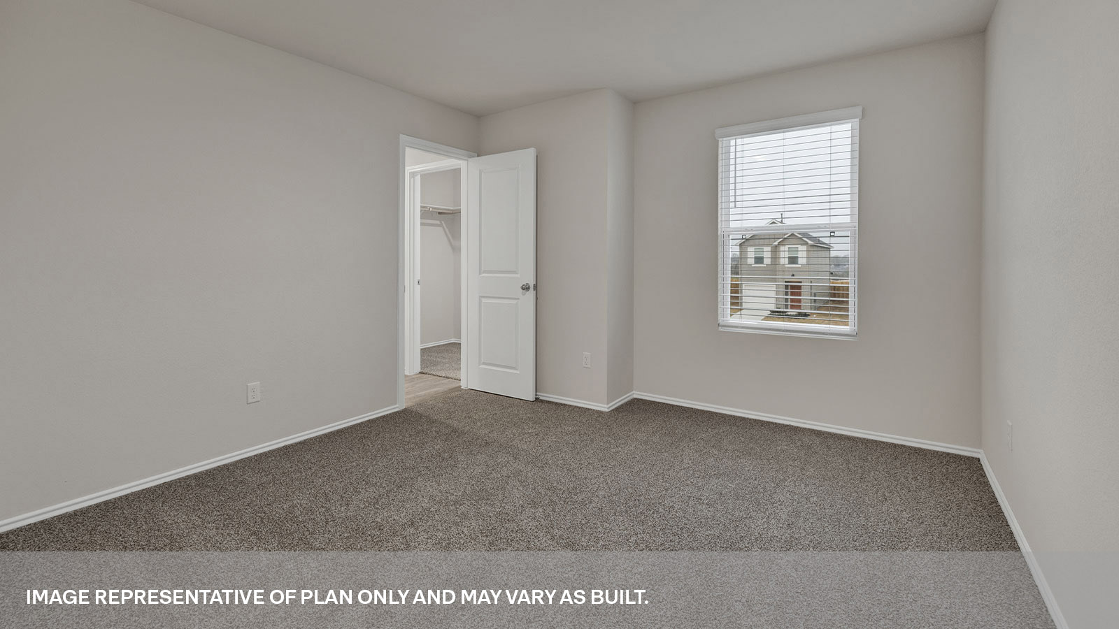 Main bedroom with carpeting with one window and entry to the bathroom and closet.