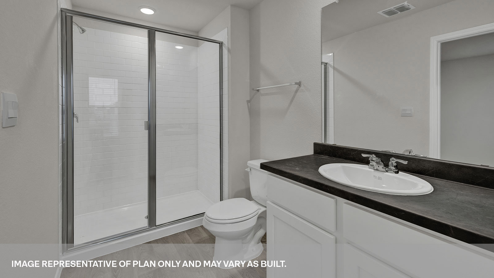 Large walk-in closet with wooden shelves and window.