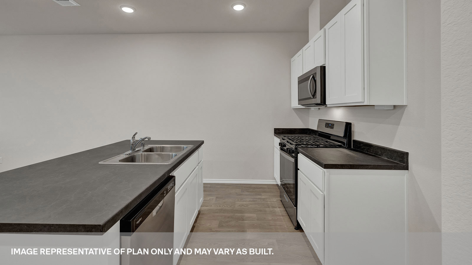 Kitchen with kitchen island and white cabinets.