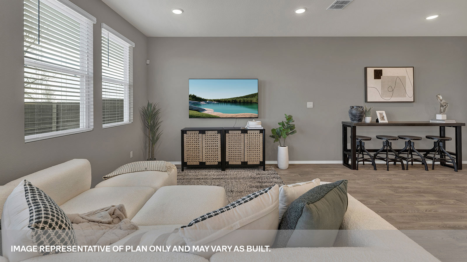Living area with 3 windows and backdoor with a half-lite window.