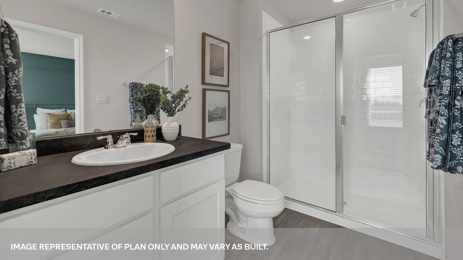 Main bathroom with large walk-in shower with glass door, toilet and a single sink vanity.