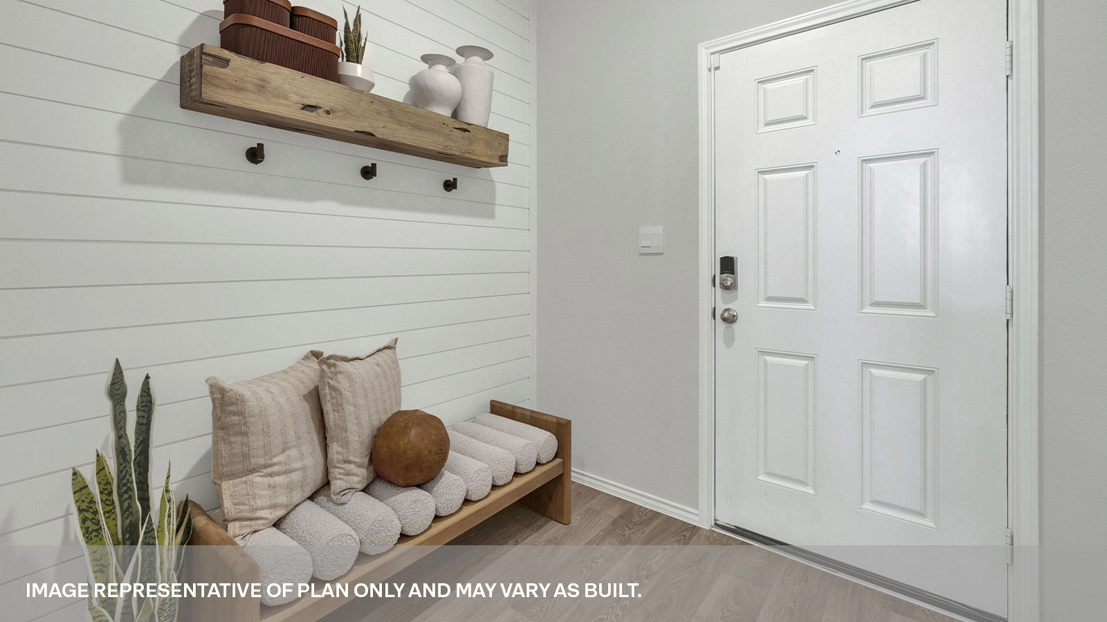 Entryway with vinyl flooring and front door.
