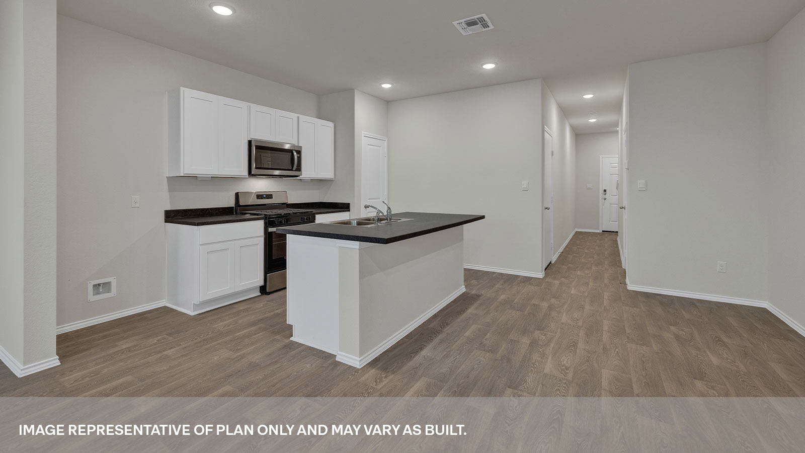 Kitchen island, entry hallway and dining area.