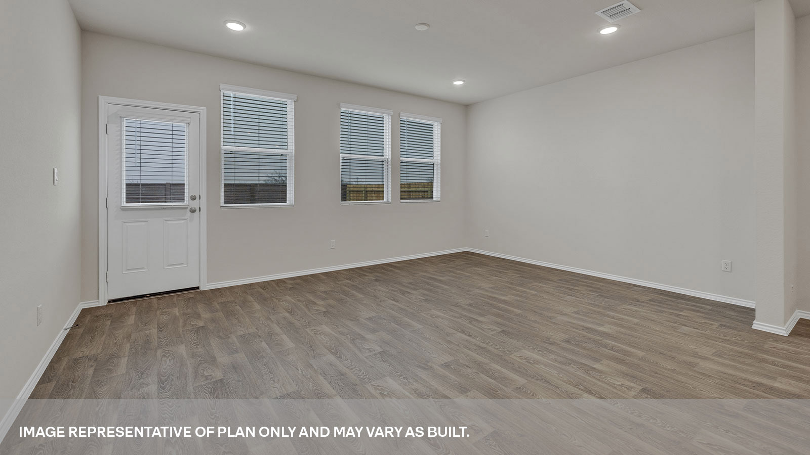 Living room with 3 windows and backdoor with a half-lite window.