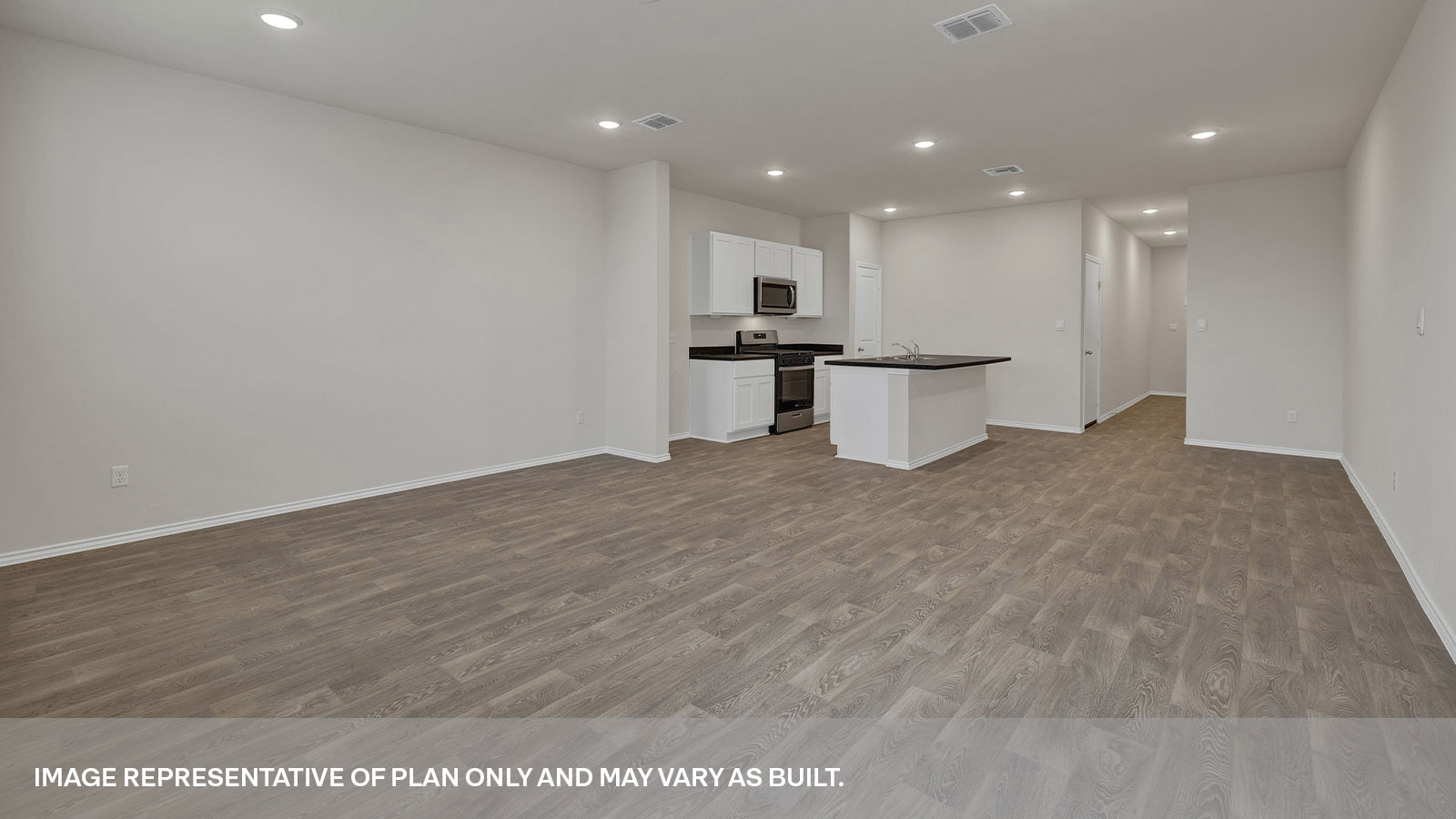 Living room overlooking the kitchen, entry hallway and dining area.