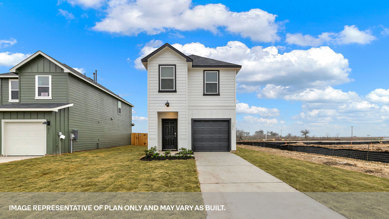 Two-story farmhouse exterior with two windows and 1 car garage.
