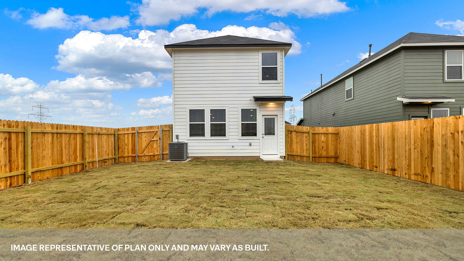 Exit back door with 4 windows and sodded backyard.