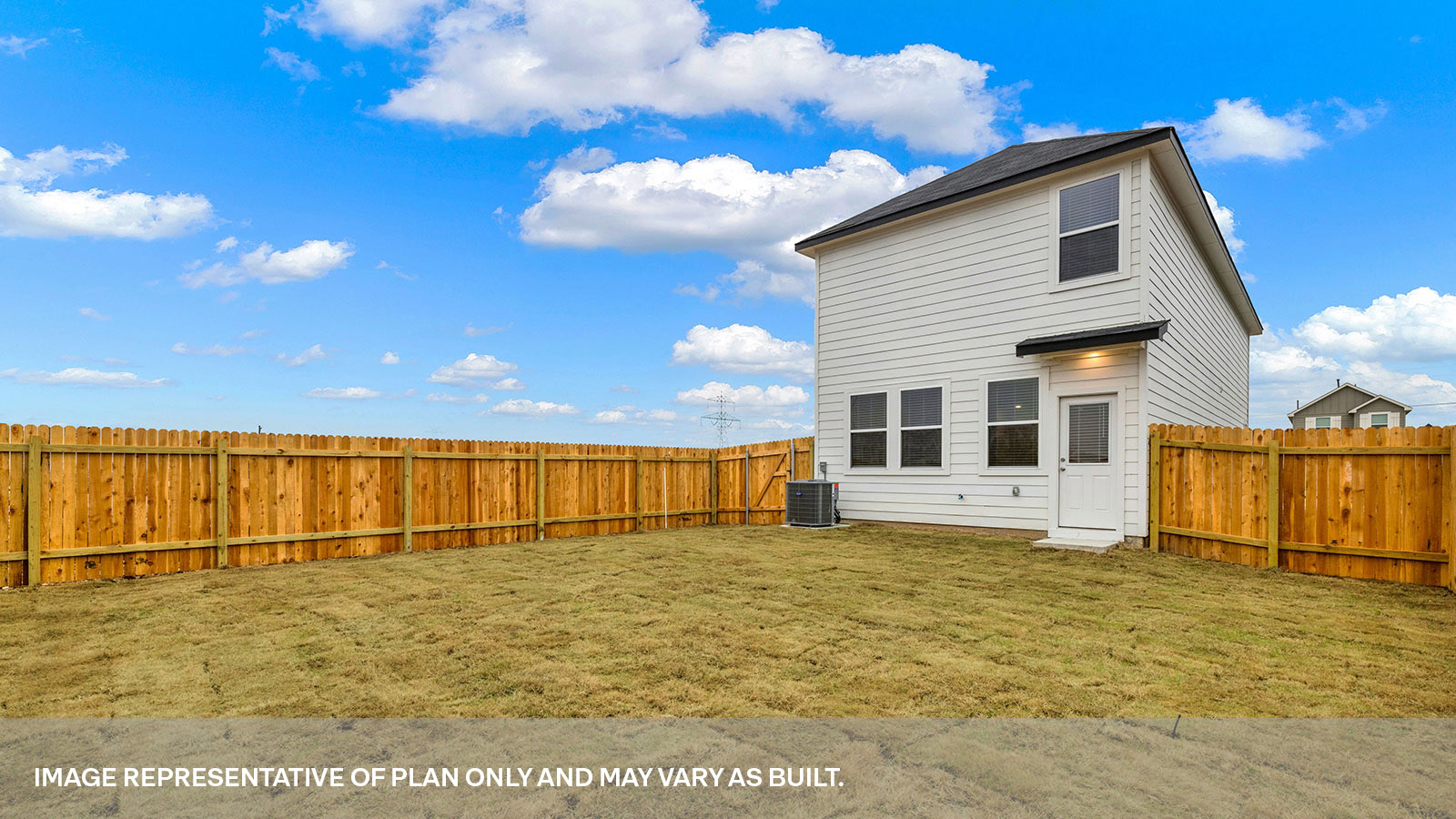 Exit back door with 4 windows and sodded backyard.