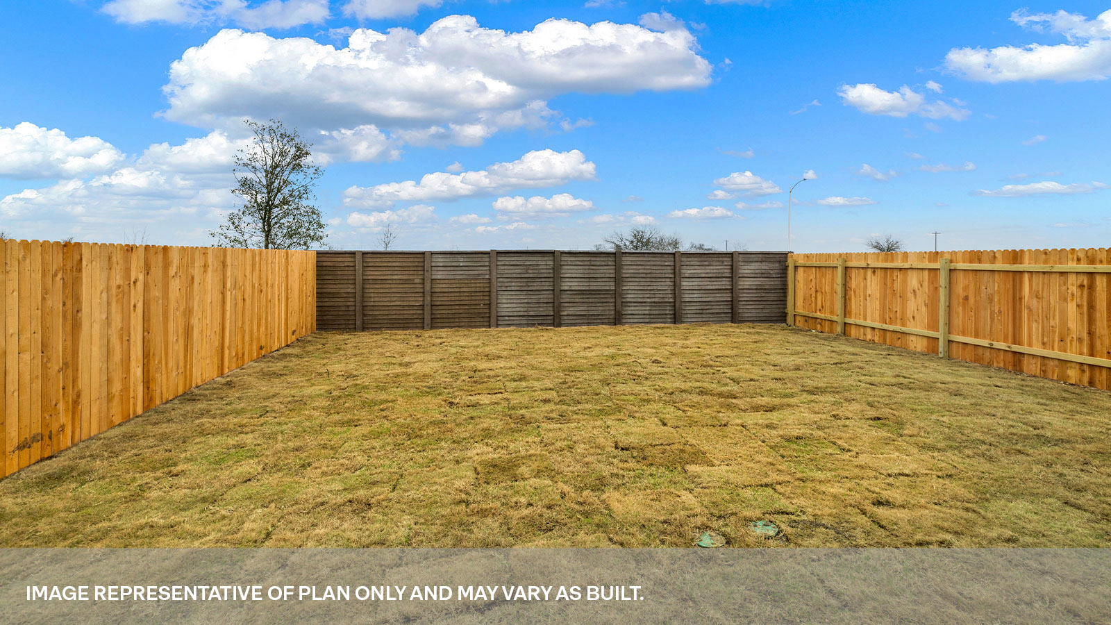 Fully sodded back yard and privacy fence.