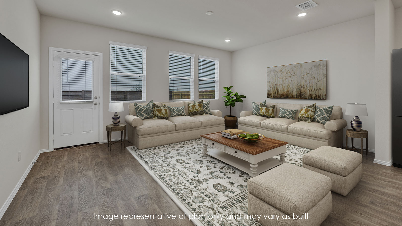 Virtually staged living room with L shaped couch, rug and decor.