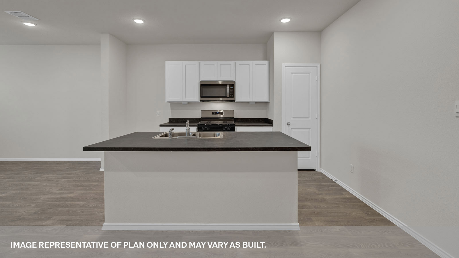 Kitchen island and countertops and pantry.
