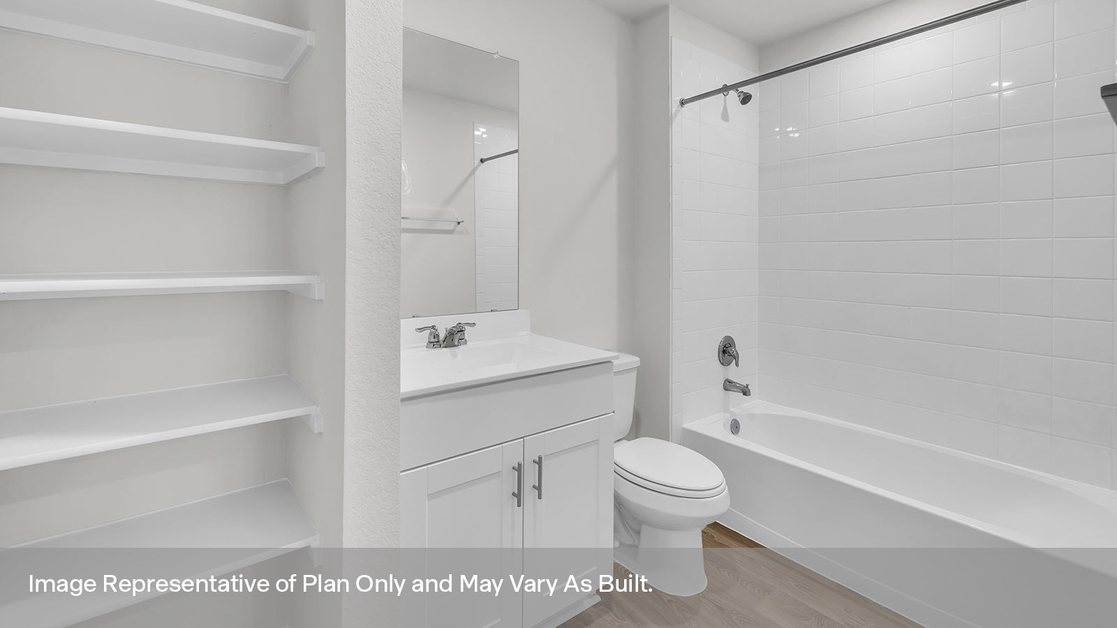 Hall bathroom with wooden shelving, vanity, toilet, and tub.