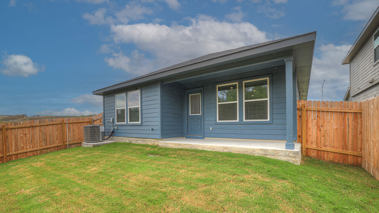 rear patio with sodded yard