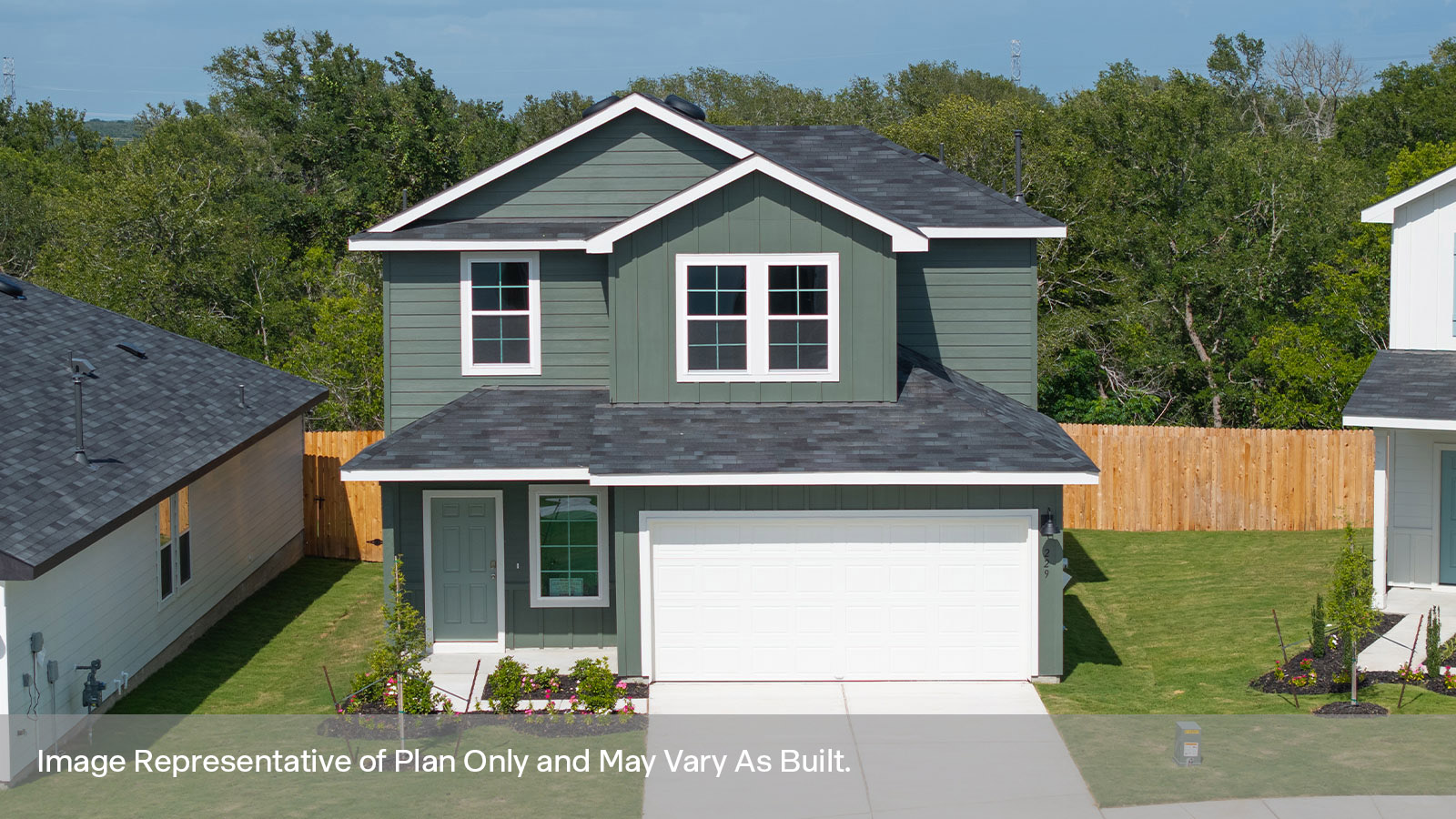 Two-story farmhouse exterior photo with 2 car garage.