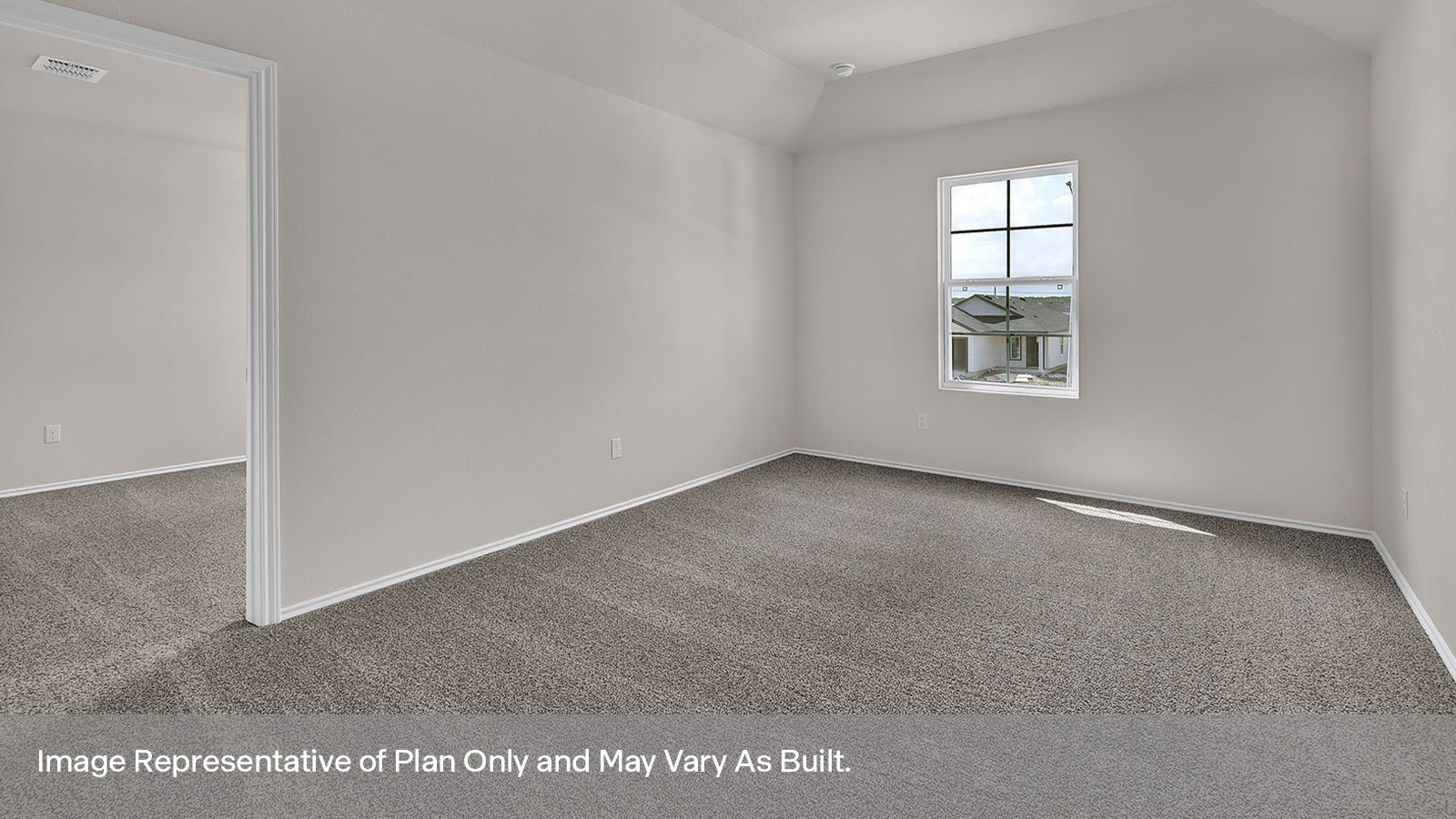 Gameroom off the stairs with carpeting and one window.