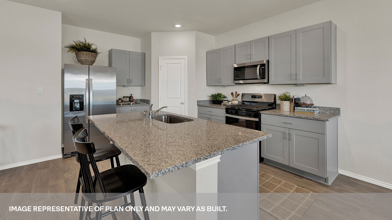 Kitchen island with sink overlooking the living room.
