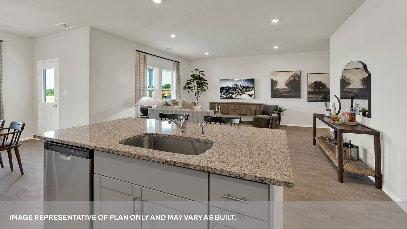 Kitchen with kitchen island and granite countertops.