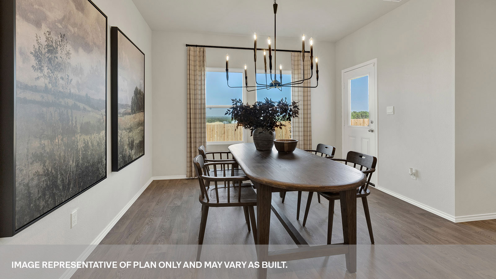 Dining room with vinyl flooring and two windows.