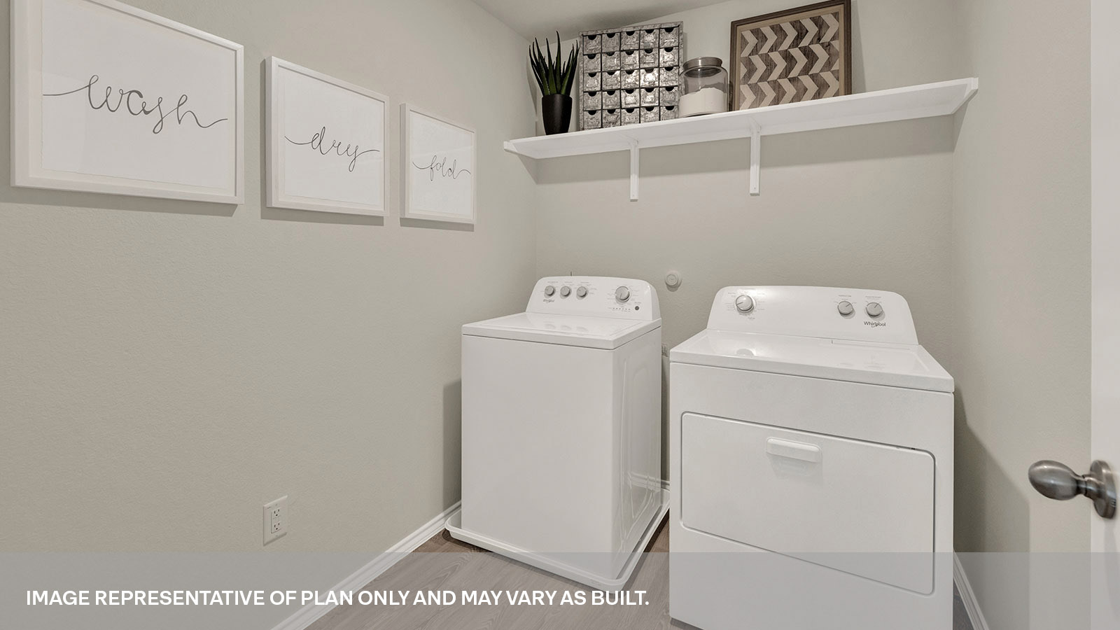 Laundry room with washer/dryer connections and wooden shelving.