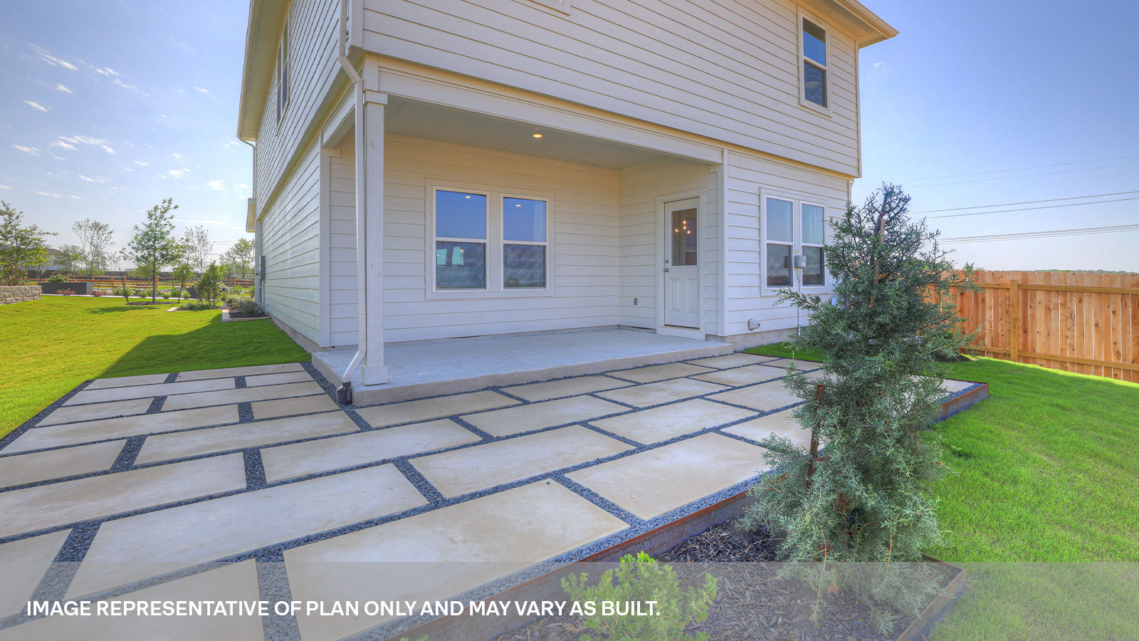 Covered patio with two windows and a half lite exterior door.