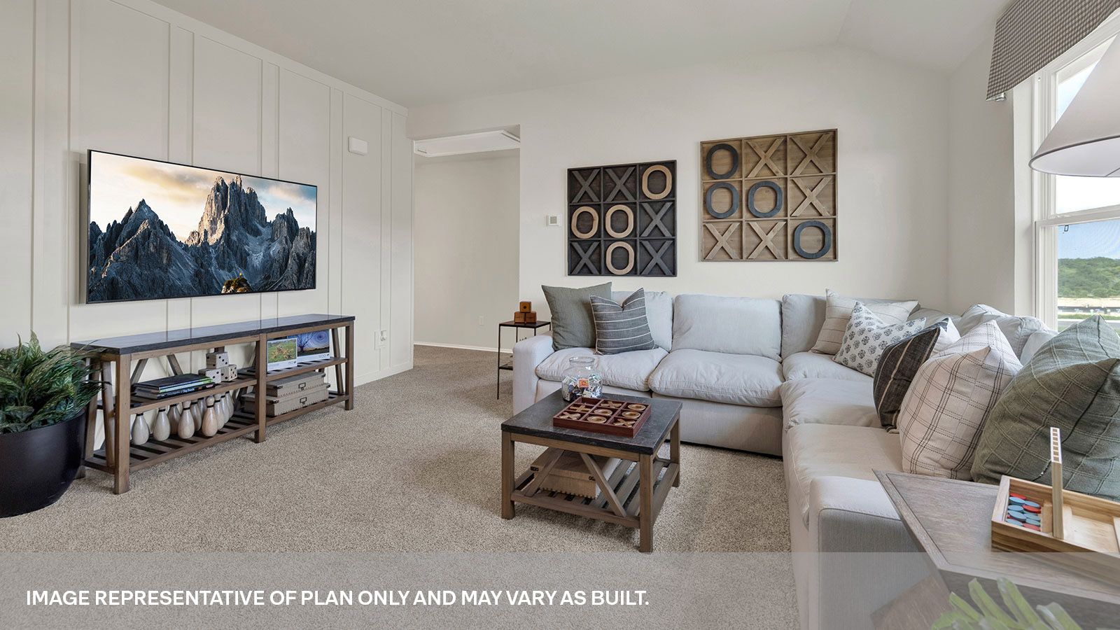 Gameroom with carpeting and bedroom hallway.