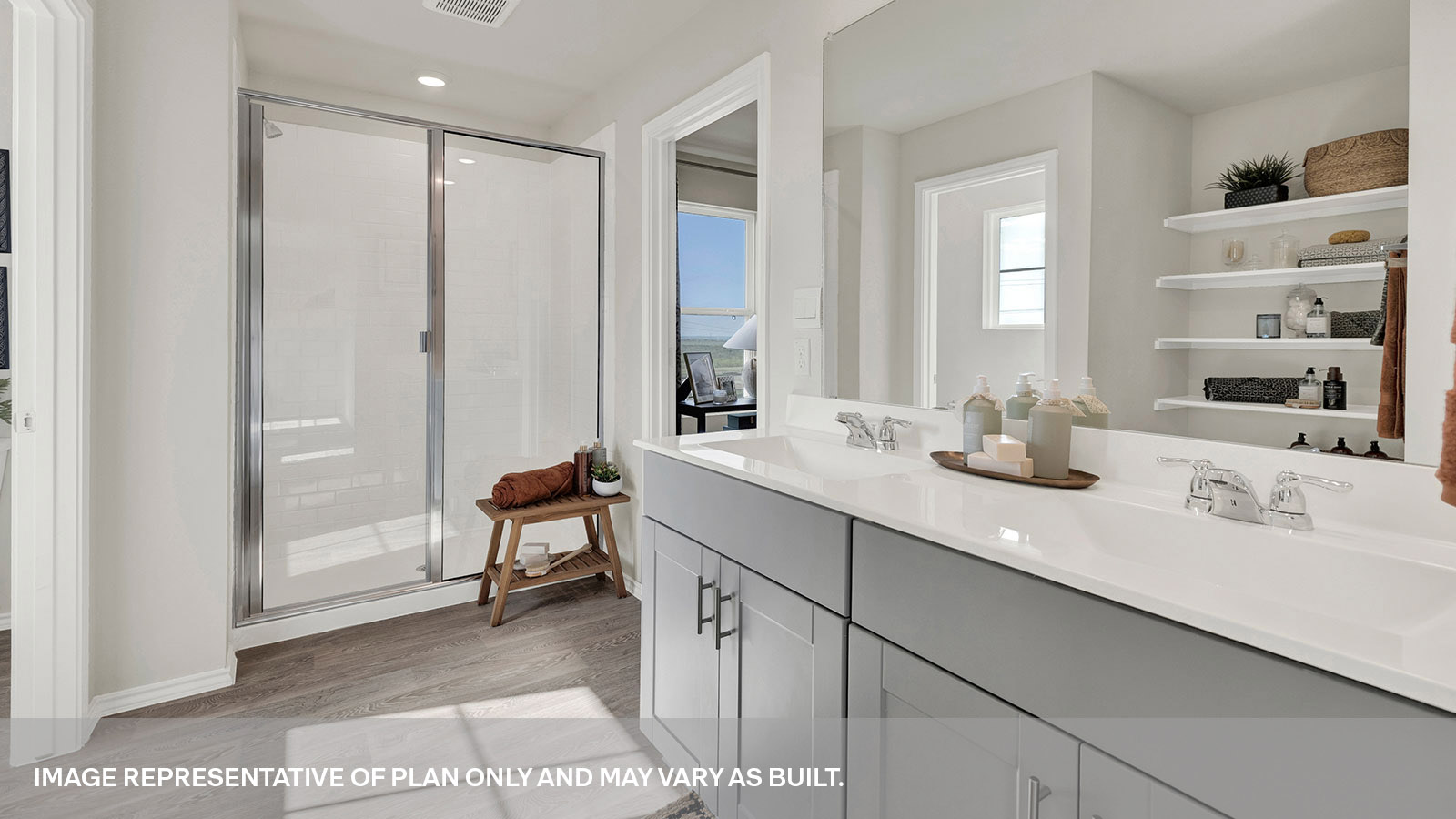 Main bathroom with double sink vanity and stand in shower.