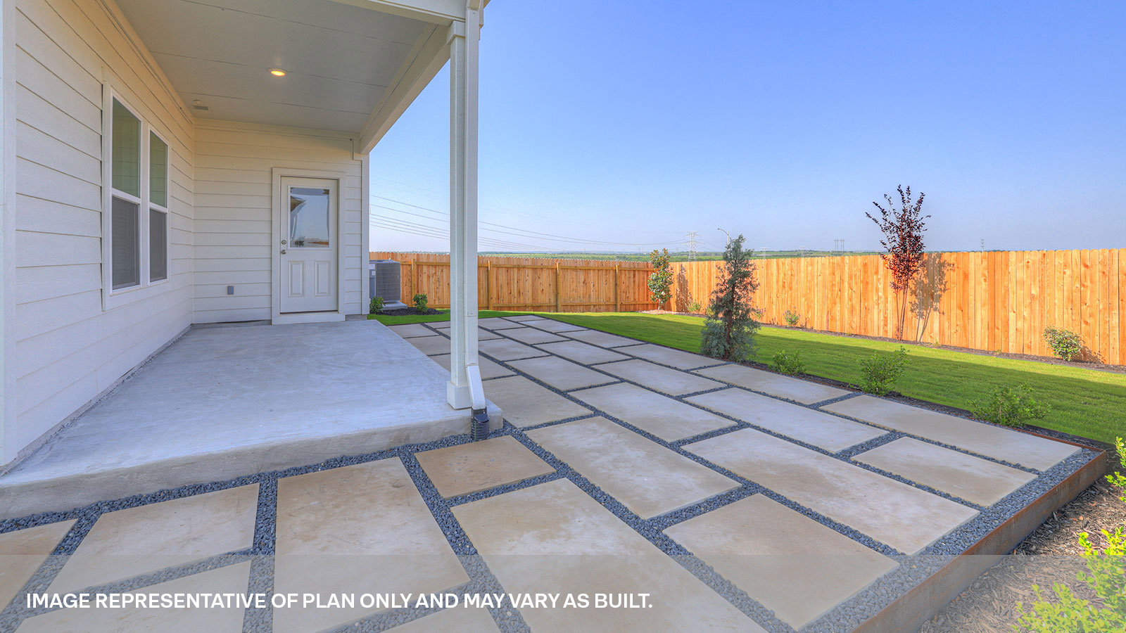 Covered patio looking into the backyard.