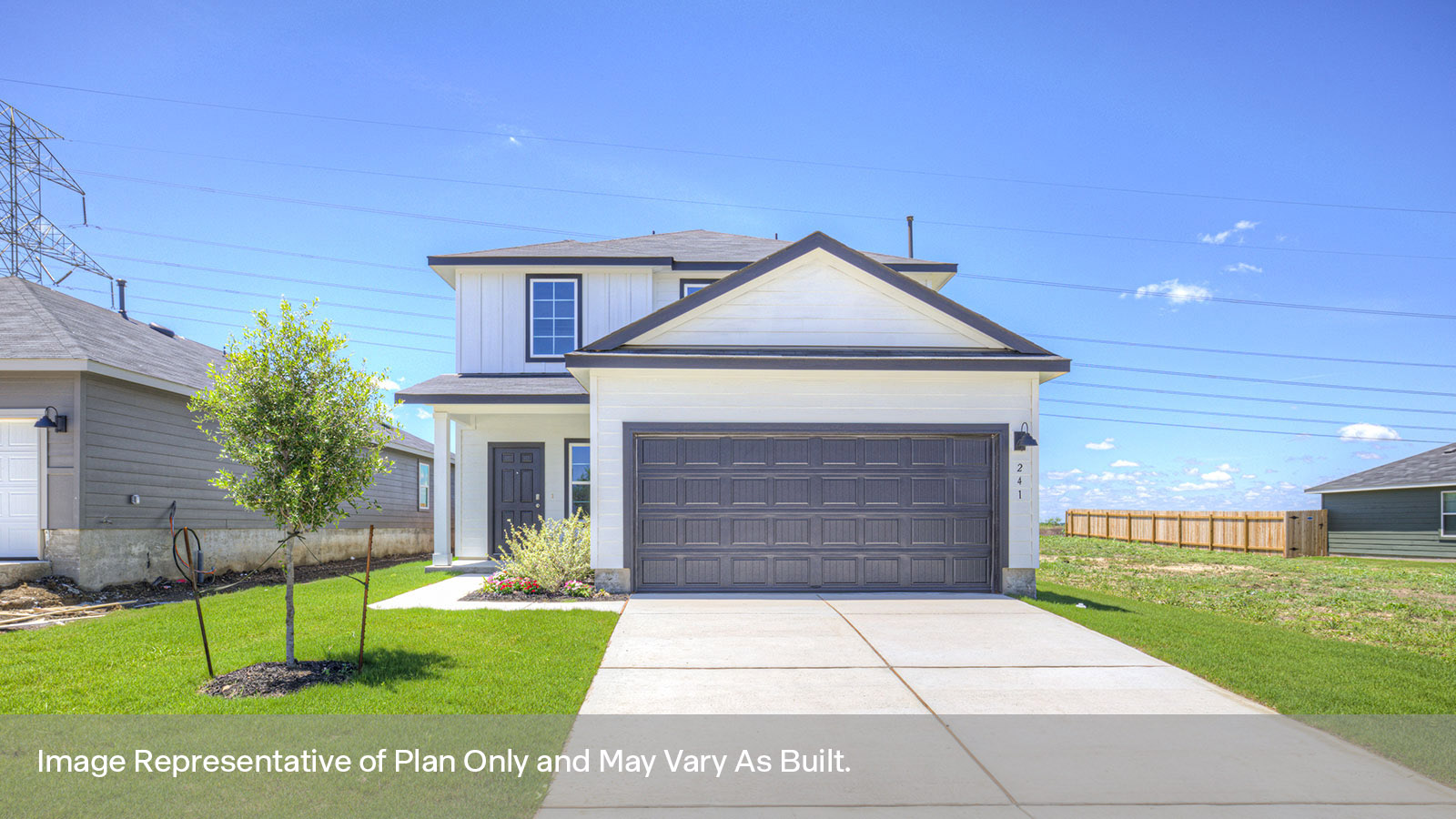 Two-story farmhouse exterior with 2 car garage.