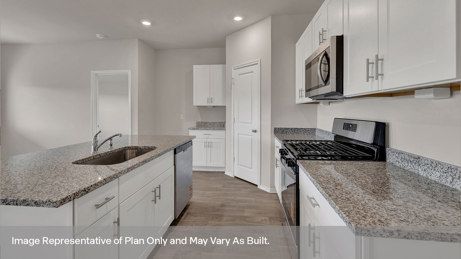 Kitchen with white cabinets and appliances.