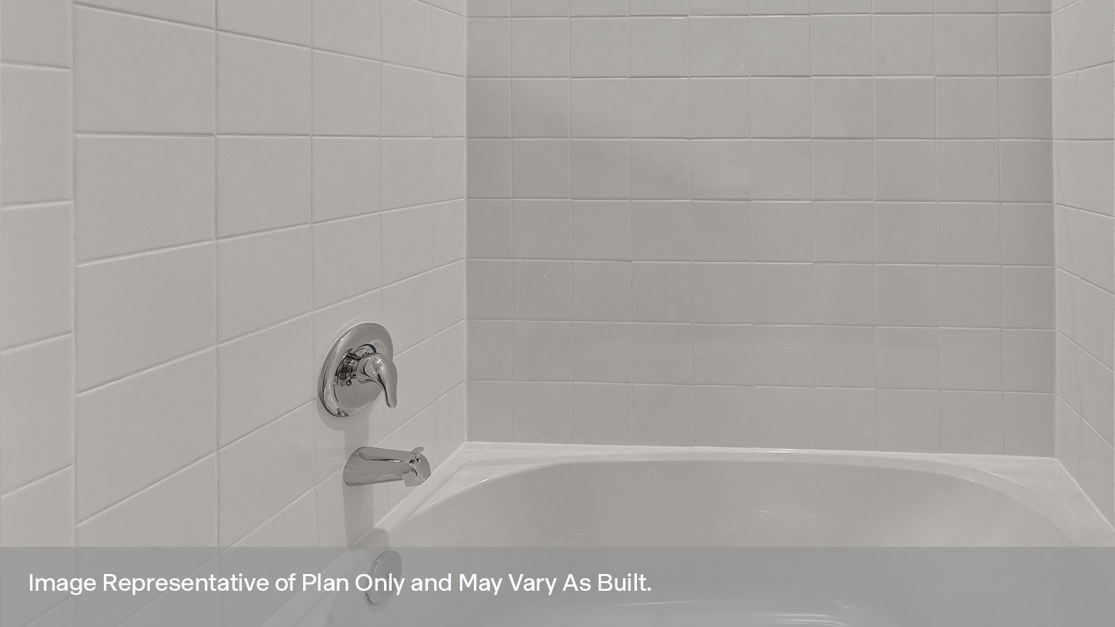 Hall bathroom with tub and tile surround.