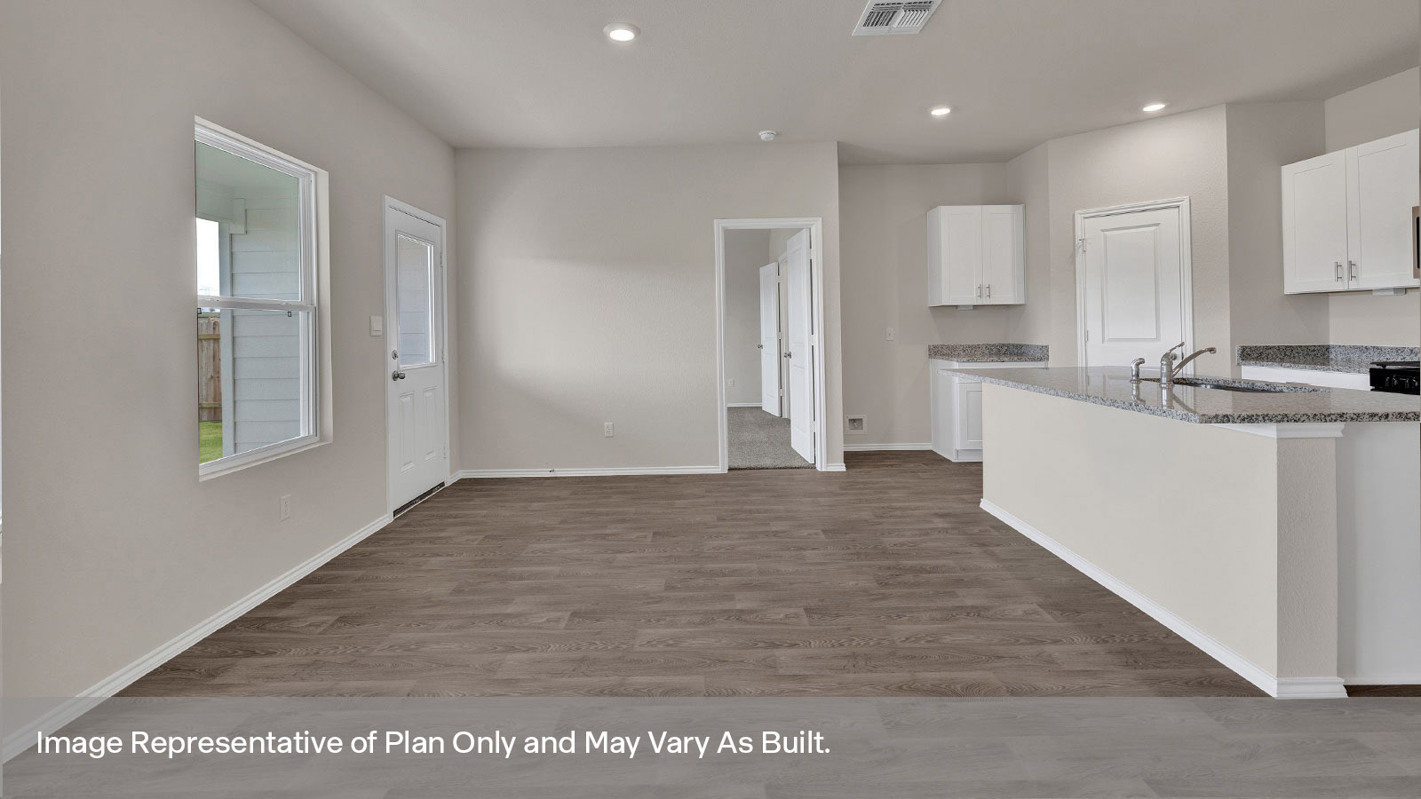 Dining room with one window and a half lite exterior door.