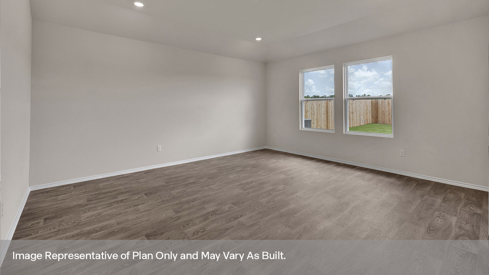 Living room with vinyl flooring and two windows.
