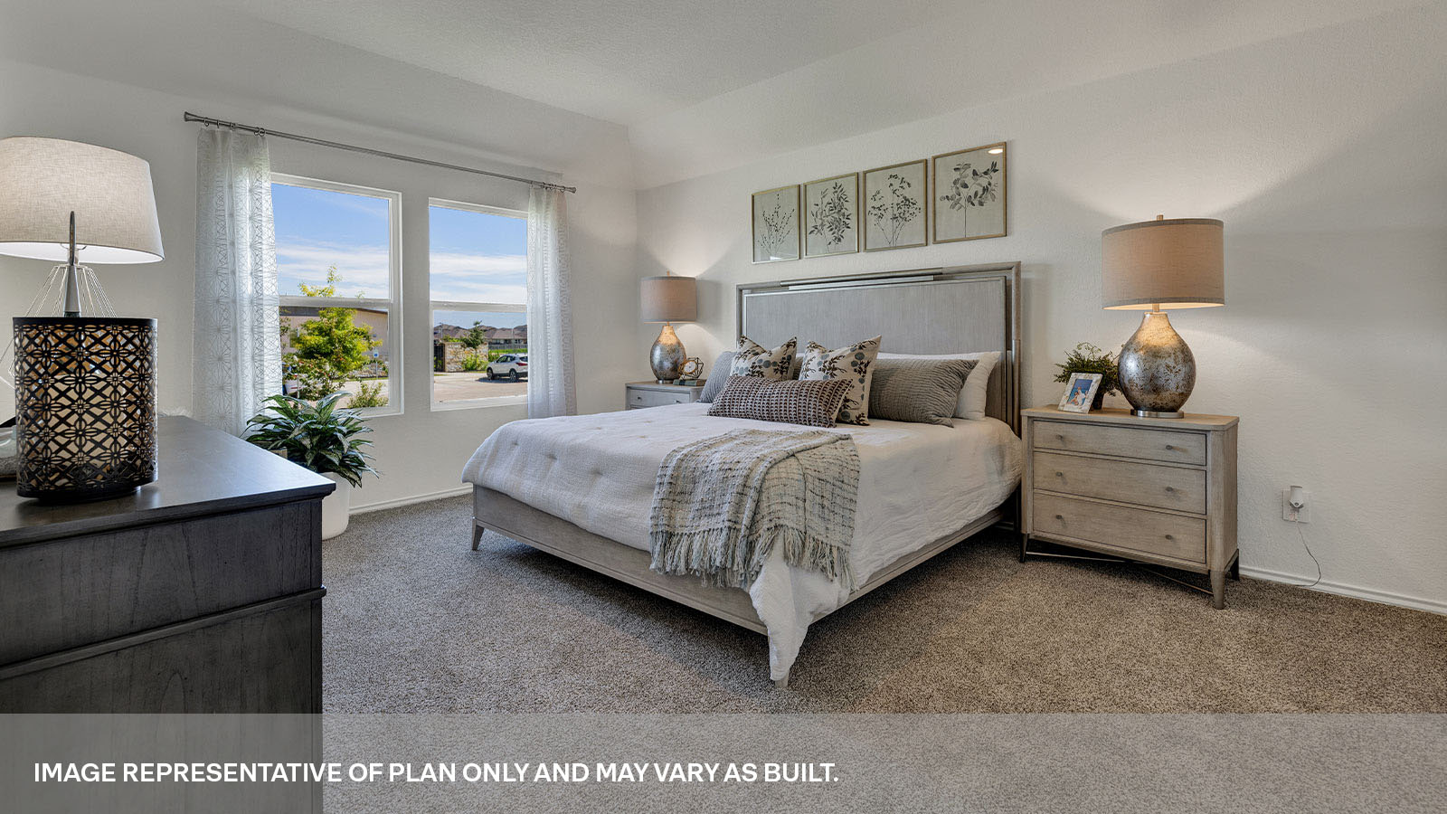 Main bedroom with carpeting and two windows.