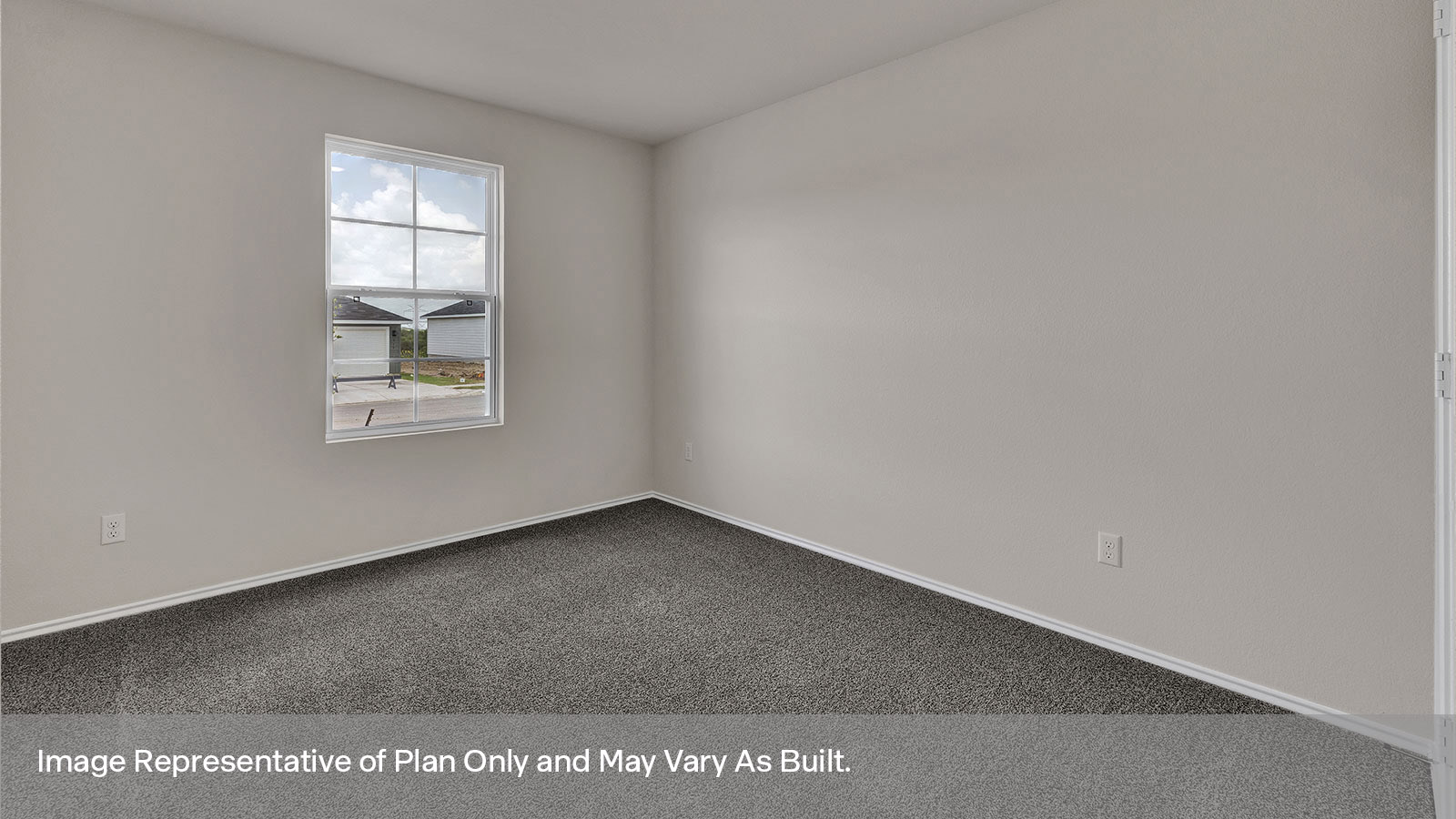 Bedroom with carpeting and one window.