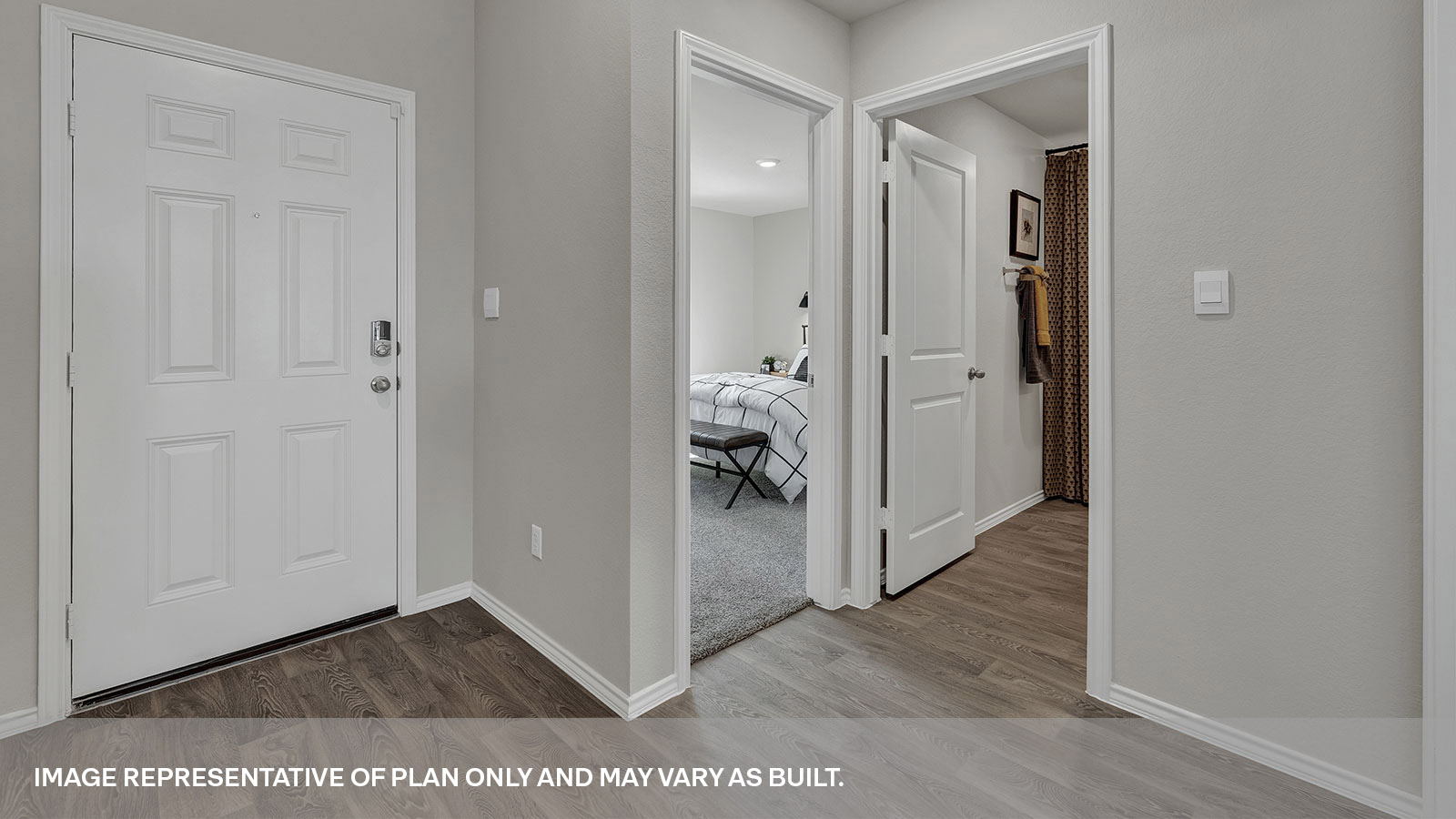 Entry hallway with vinyl flooring and front door.
