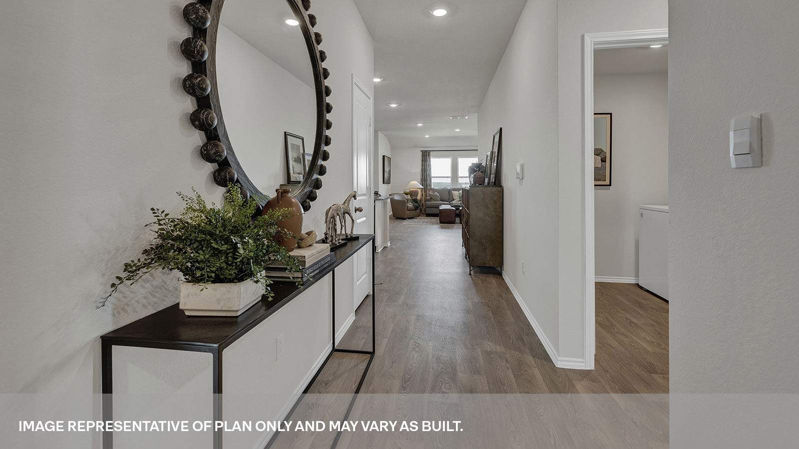 Entry hallway with vinyl flooring and front door.