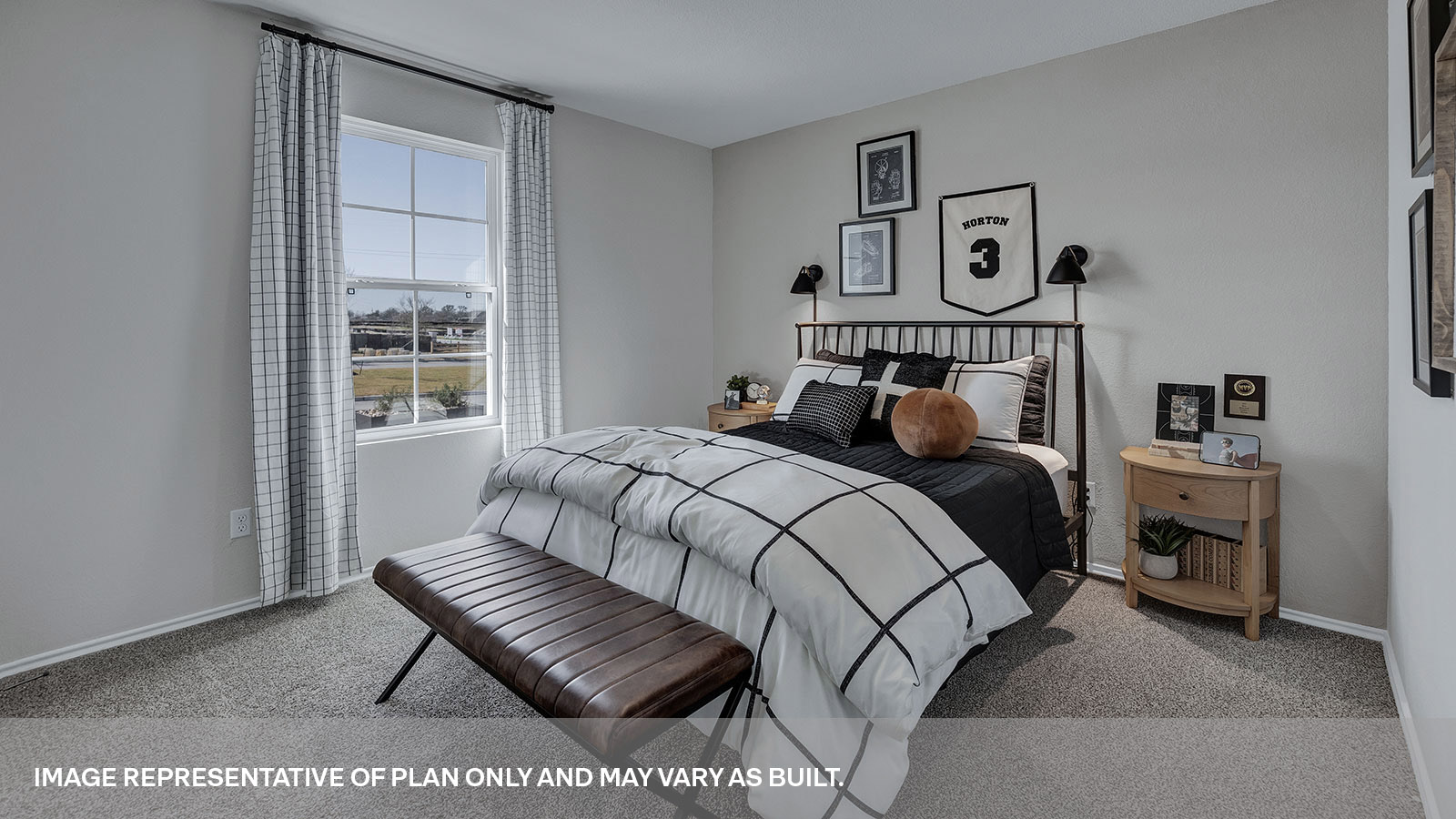 Front bedroom with carpeting and two windows.
