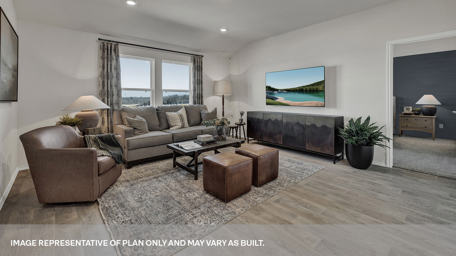 Living room and dining room with vinyl flooring.