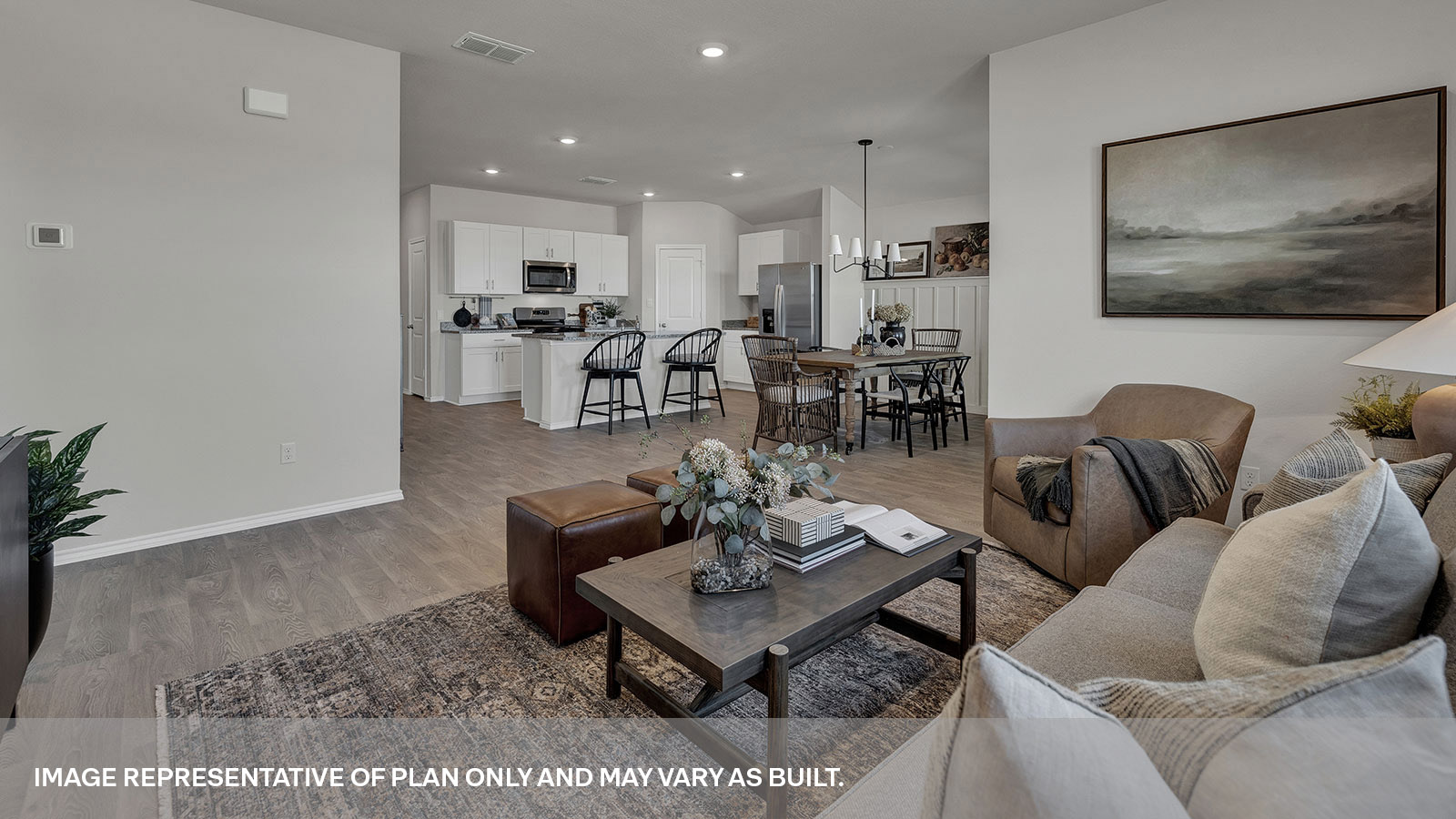 Living room and dining room with vinyl flooring.