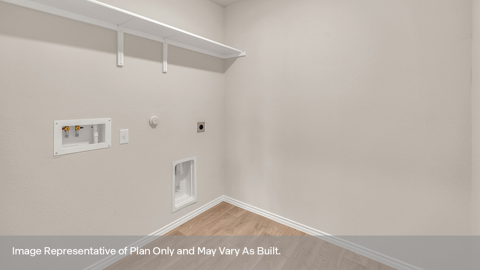 Laundry room with a wood shelf and washer/dryer connections.