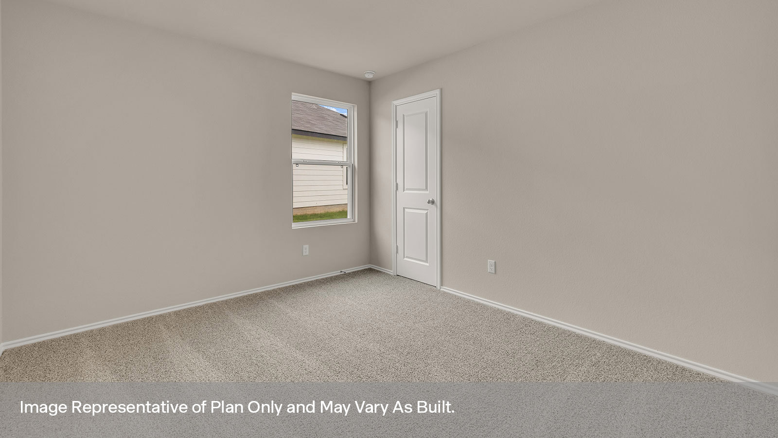 Fourth bedroom with carpeting, a window showing the side yard and closet door.