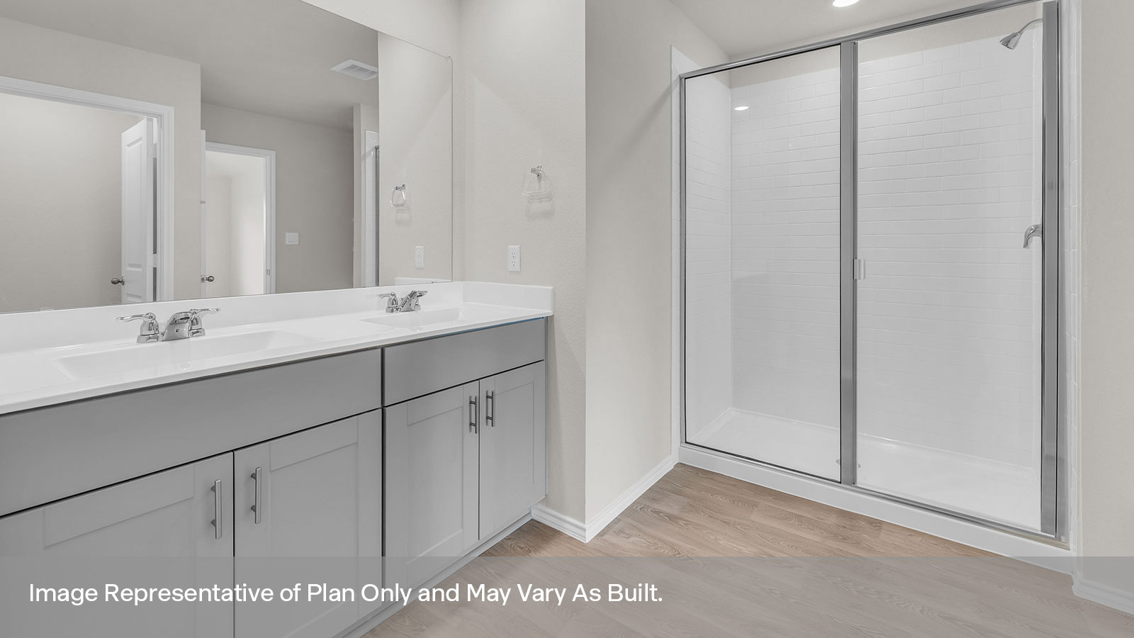 Main bathroom with a double sink and walk-in shower.