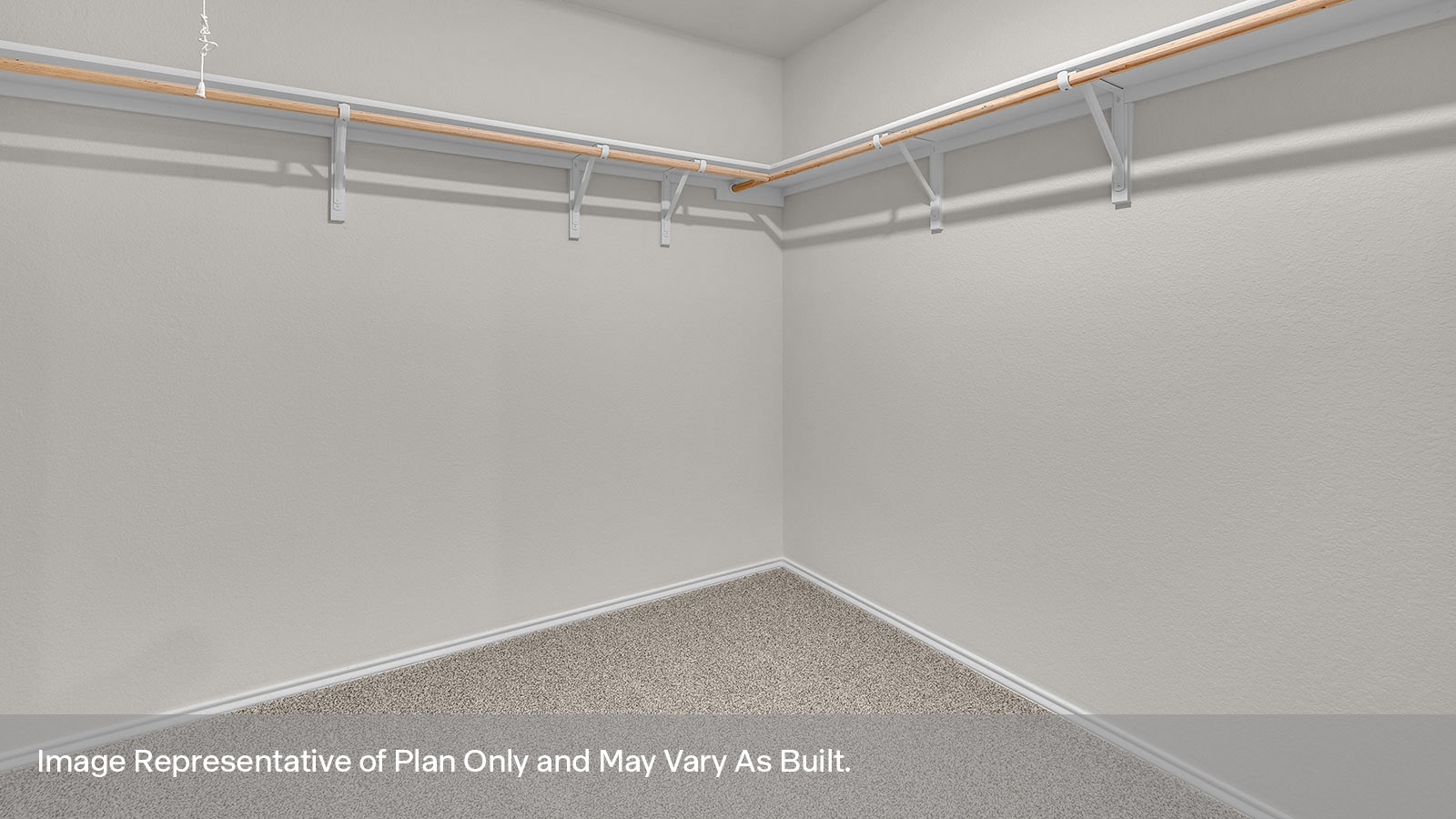 Walk-in closet with wooden shelves.